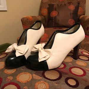 Black and white heeled booties size 7.5